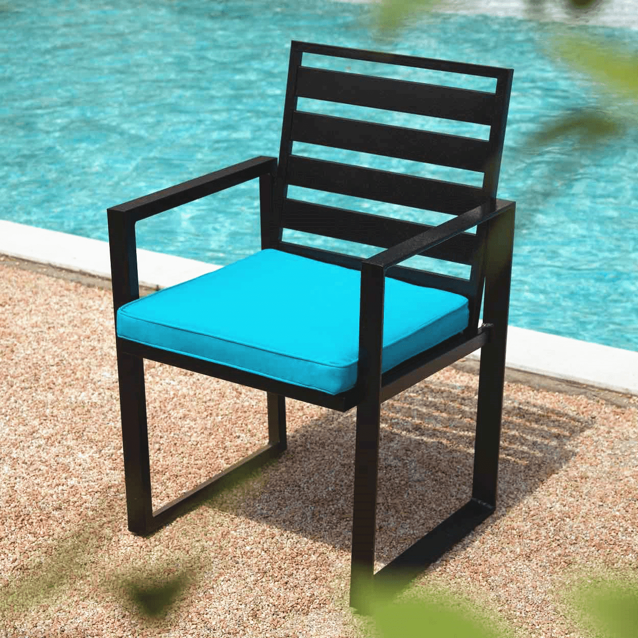 patio dining chair with blue cushion